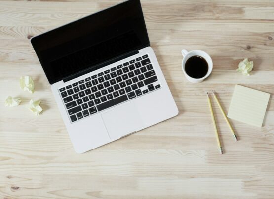 Photo by Lauren Mancke turned off MacBook Pro beside white ceramic mug filled with coffee