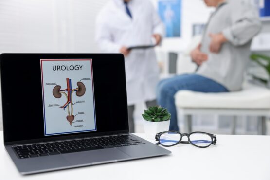 Man,Having,Appointment,With,Urologist,In,Clinic,,Focus,On,Laptop